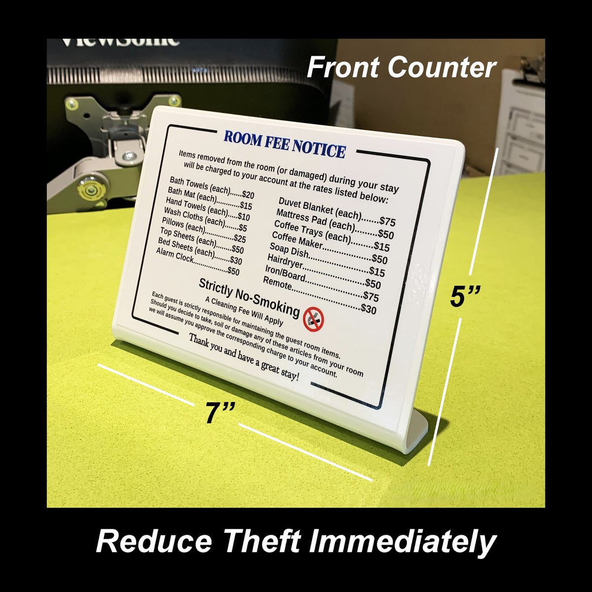 A white plastic room fee notice sign with black text, shown on a yellow-green surface with measurement labels indicating 5 inches tall and 7 inches wide, plus text reading 'Front Counter' and 'Reduce Theft Immediately'.